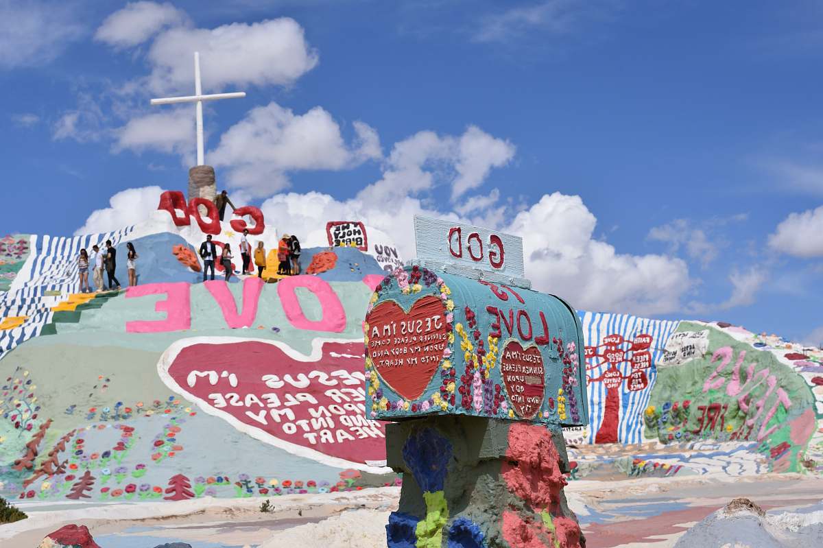 salvation mountain multicolored God is Love paintings under clear blue sky art